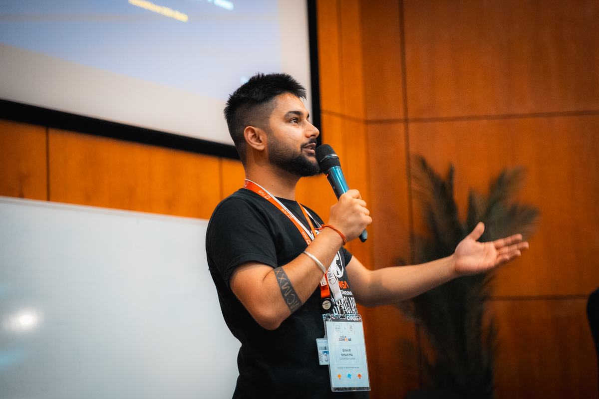 Sahir Sharma speaking to participants during the hackathon.